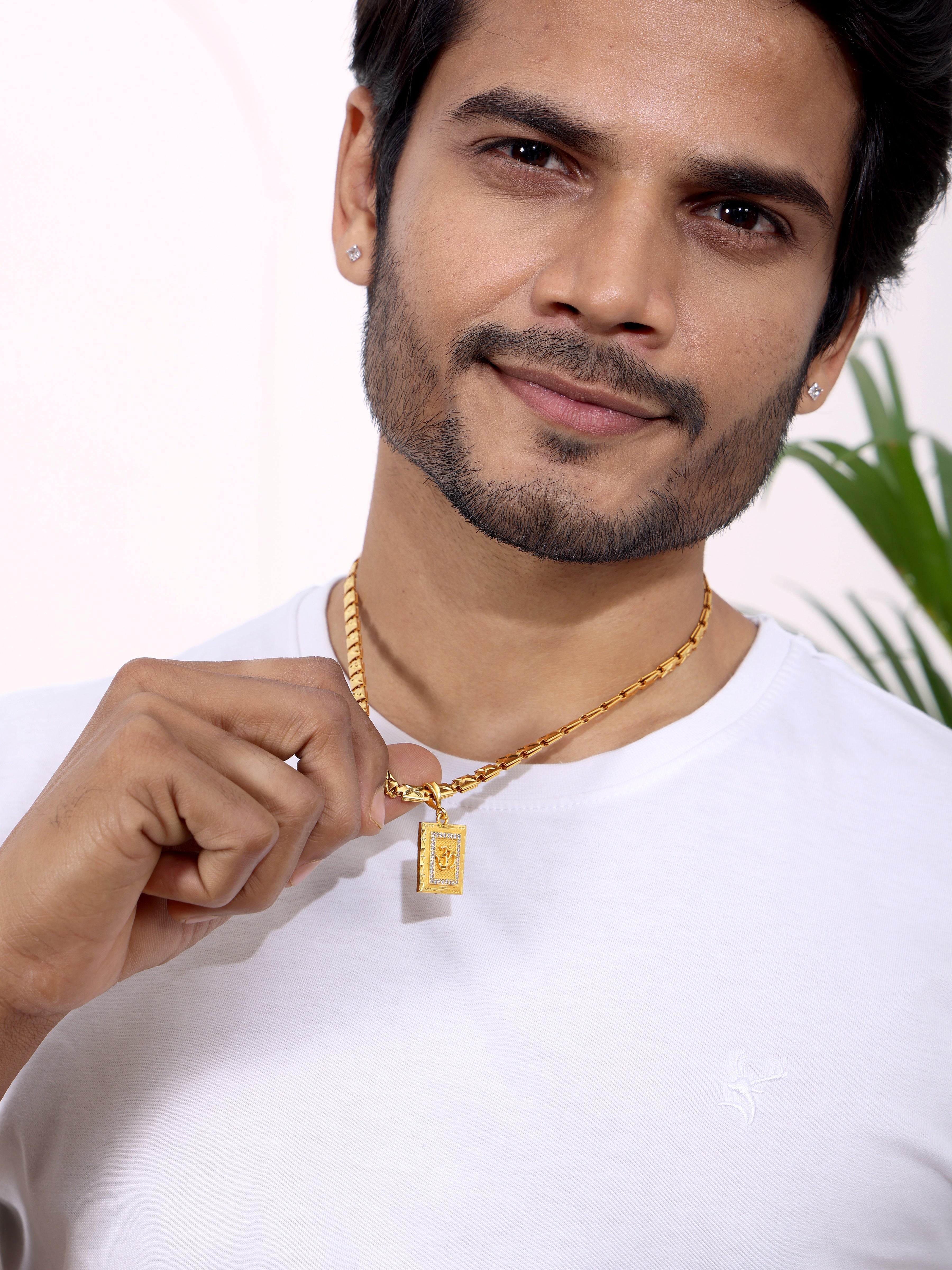 Om Pendant With a Statement Gold Chain